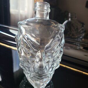 Clear glass head empty bottle. Halloween decor.